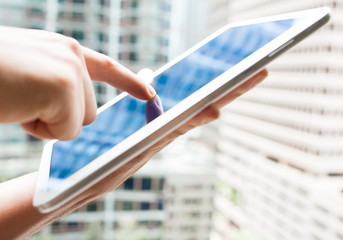 Closeup of man using tablet. 