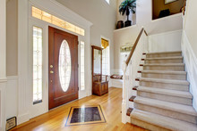 Nice Entryway To Home With Carpeted Staircase, And White Interio