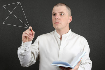 man in the bright shirt draws a handle geometrical figure