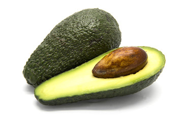 One whole and one sliced avocado