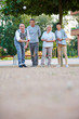 © Robert Kneschke - Senioren spielen zusammen Boule im Sommer