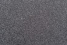 Speckled Textured Monochrome Background From Fabric Of Graphite Color