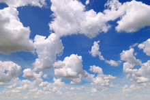 Cumulus Clouds In The Blue Sky