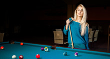 Fashion Portrait Of Beautiful Young Blonde Girl Plays Billiard