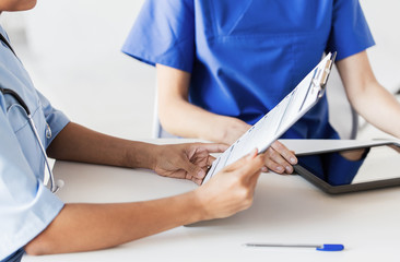 Wall Mural - close up of doctor with medical report at hospital