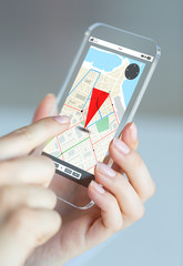 Poster - close up of woman with gps navigator on smartphone