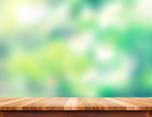Aufkleber - Empty plank brown wood table top with blur green tree background