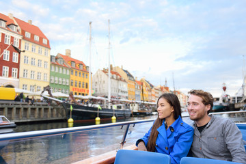 copenhagen tourists people on cruise boat tour on water canal in old port nyhavn. young multiracial 