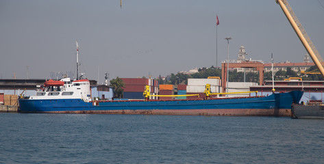 Cargo ship loading in a trading port