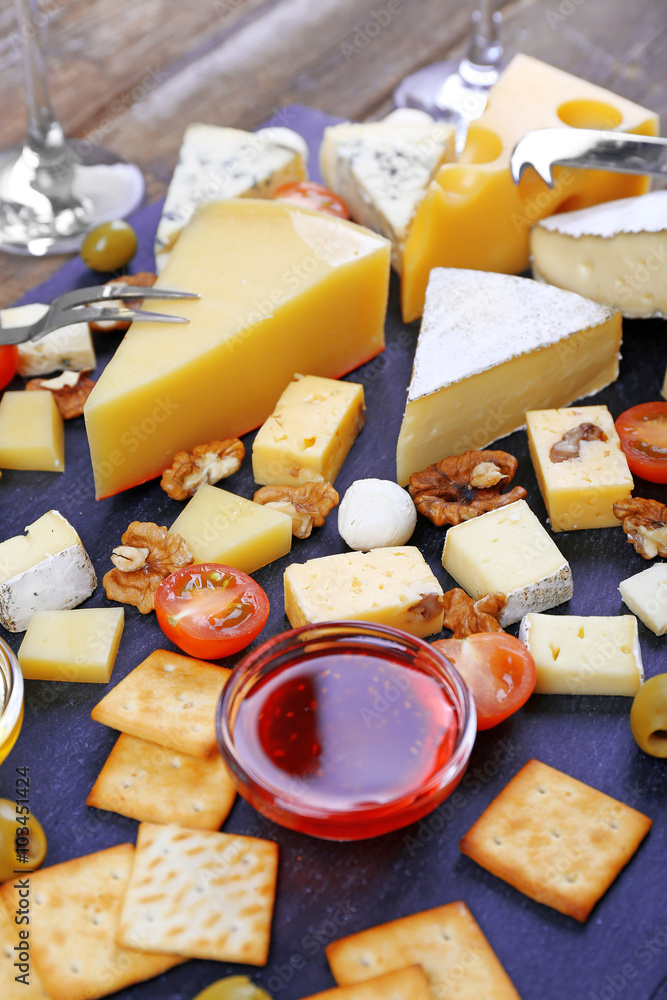 Cheese for tasting on wooden table, closeup