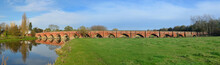 All Seventeen Arches Of The Fifteenth Century Packhorse Bridge At Great Barford Bedfordshire England.