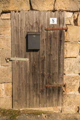 old wooden door in a sandstone wall