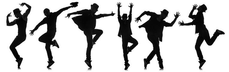 Wall Mural - Silhouettes of dancers in dancing concept