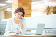 © Drobot Dean - Businesswoman writing notes