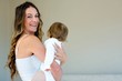 © WavebreakmediaMicro - smiling woman holding a baby