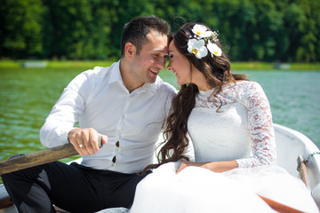 stylish gorgeous happy brunette bride and elegant groom in the b