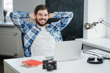 relaxed businessman with laptop computer