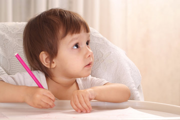 Wall Mural - little girl drawing at home