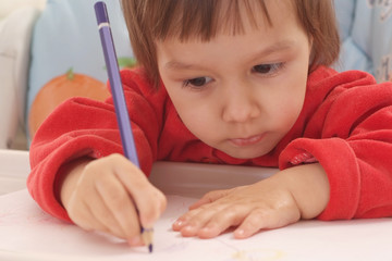 Wall Mural - little girl drawing at home