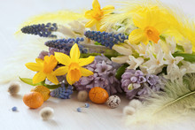 Easter Spring Flowers Hyacinths, Daffodils And Eggs On A Wooden Table
