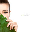 © Casther - Beauty Spa Woman with a Fresh Leaf over Face