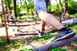 © davit85 - adventure climbing high wire park - people on course in mountain