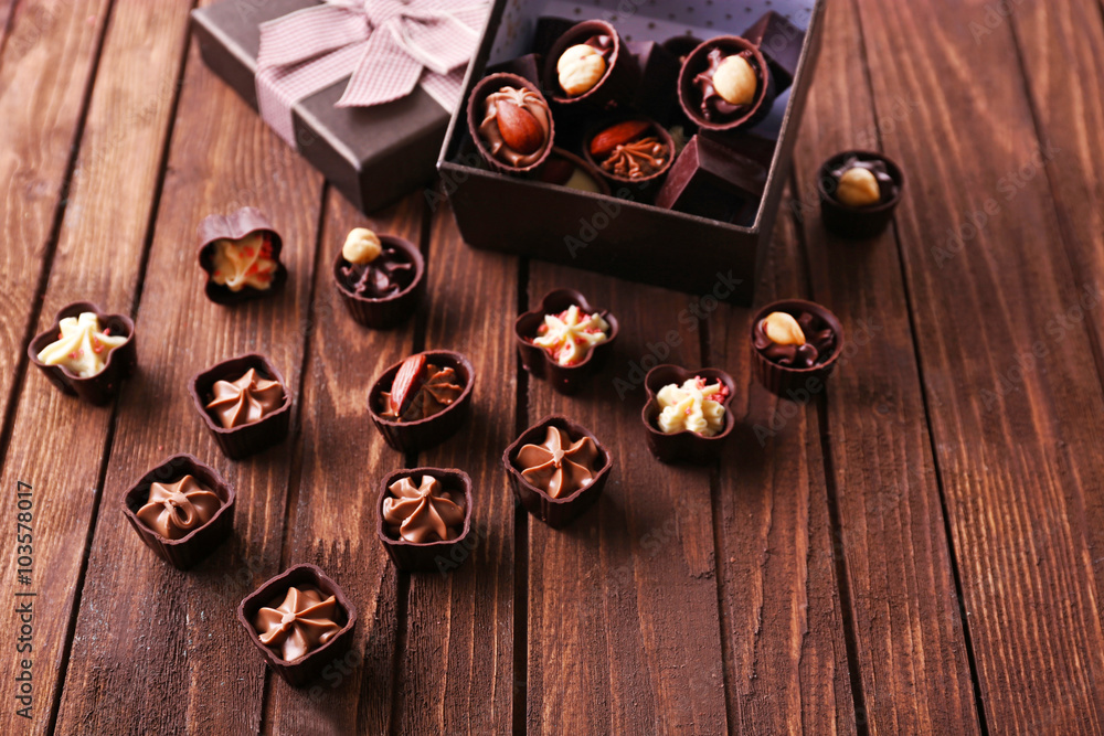 Chocolate sweets on wooden background
