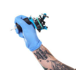 Wall Mural - Tattooist hand in blue glove with tattoo machine isolated on white background, close up