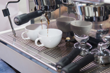 Espresso machine working with bar interior background