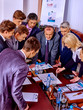 © Gennadiy Poznyakov - Happy group business collectively solve problem in office.