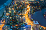 Fototapeta Miasto - City skyscrapers and traffic at night, aerial, long exposure