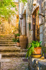 Fototapete - Idyllic view of an mediterranean rustic house and stone stairs 