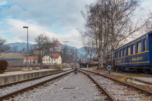 Kamnik, Slovenia - January 25, 2016. Small Town Railway Station With Restaurant Wagon On Track And Castle Zaprice On The Background.