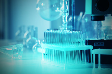 Wall Mural - microscope and glassware in laboratory