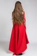 Back view of a woman in red dress with long beautiful hair