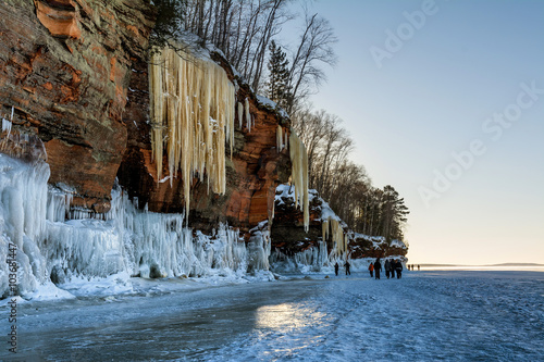 People Provide Scale For The Massive Icicles Hanging From