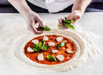 chef making pizza