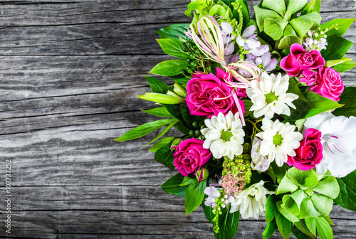 Fotografie, Obraz wedding bouquet with roses and white gerberas on an old wooden t