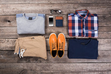 Men's Clothes On Wooden Board