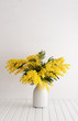 Vase with mimosa flowers