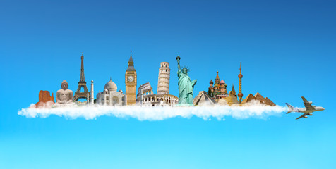 Fototapete - Famous monuments of the world behind a plane in blue sky