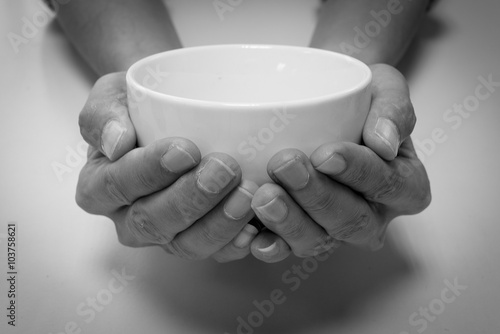 Fotografía Hunger begging with white bowl