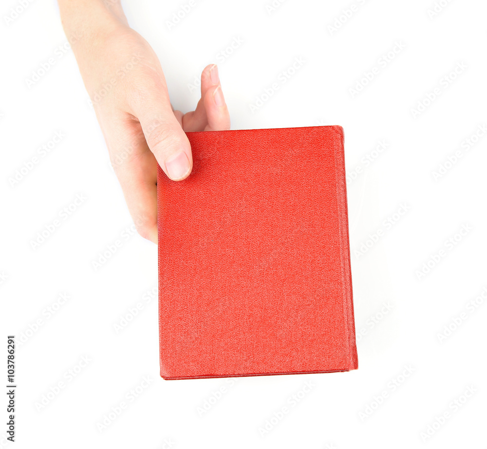 Female hand holding book, isolated on white