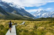 Woman hiker hiking on Hooker Valley Track
