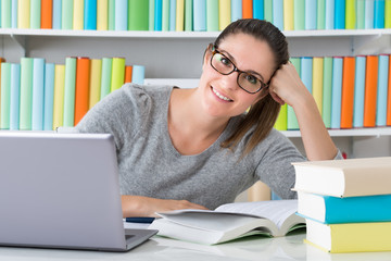 Young Woman Studying In Library