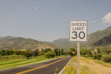 Wall Mural - Three Road Signs - Speed Limit 30, Pedestrian Crossing, Sharp Turn