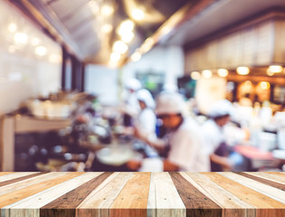 Aufkleber - Empty wood table with blur open cooking restaurant background,Mo