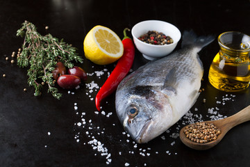 Canvas Print - Fresh fish dorado with fragrant spices, herbs and spices