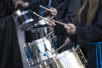 people drumming during Holy Week in Teruel, Spain