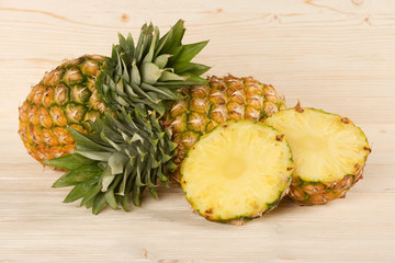 Wall Mural - pineapple on a wooden background